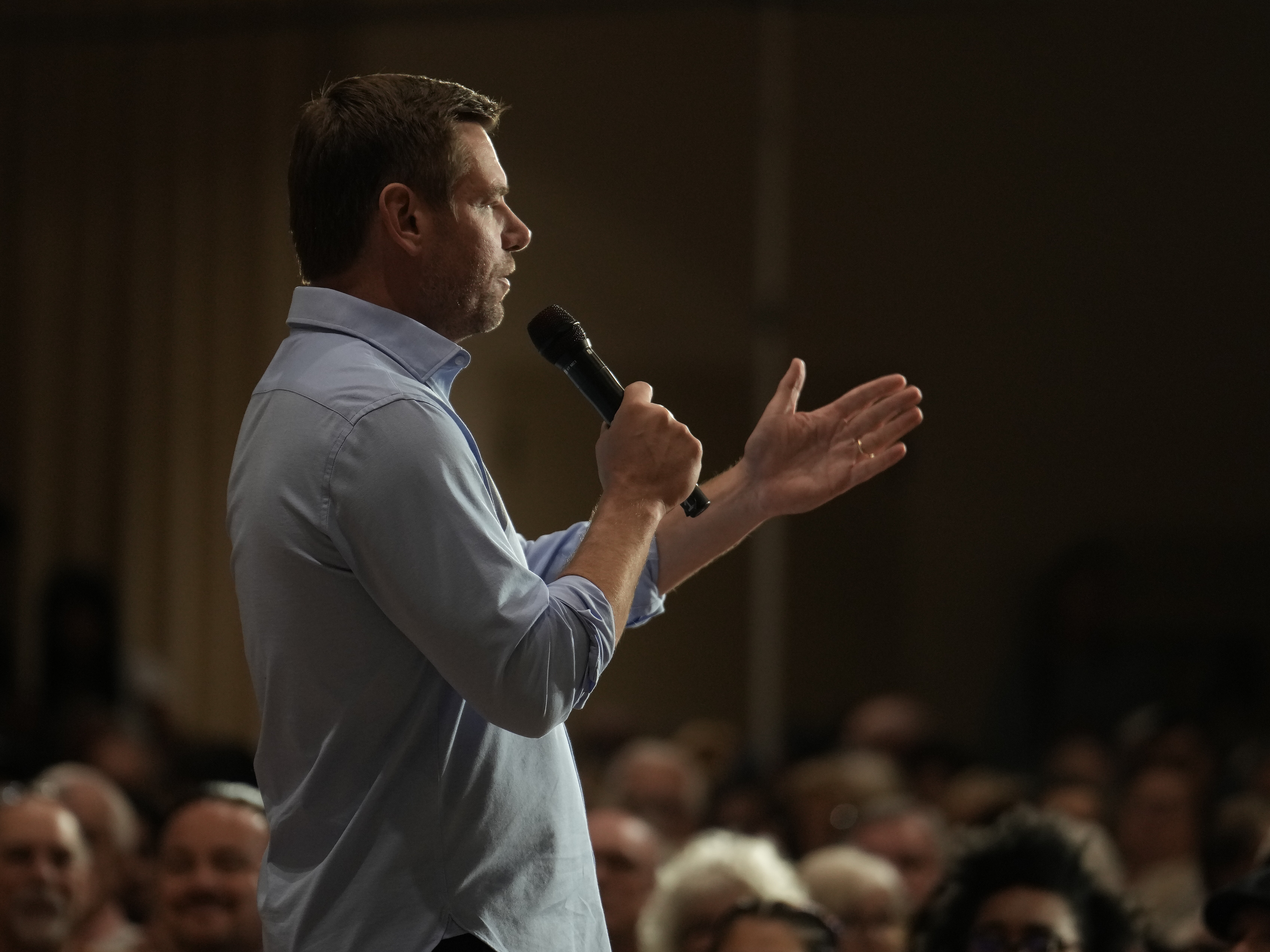 caption: Rep. Eric Swalwell, D-Calif., speaks at a town hall meeting in Sacramento, Calif., last week