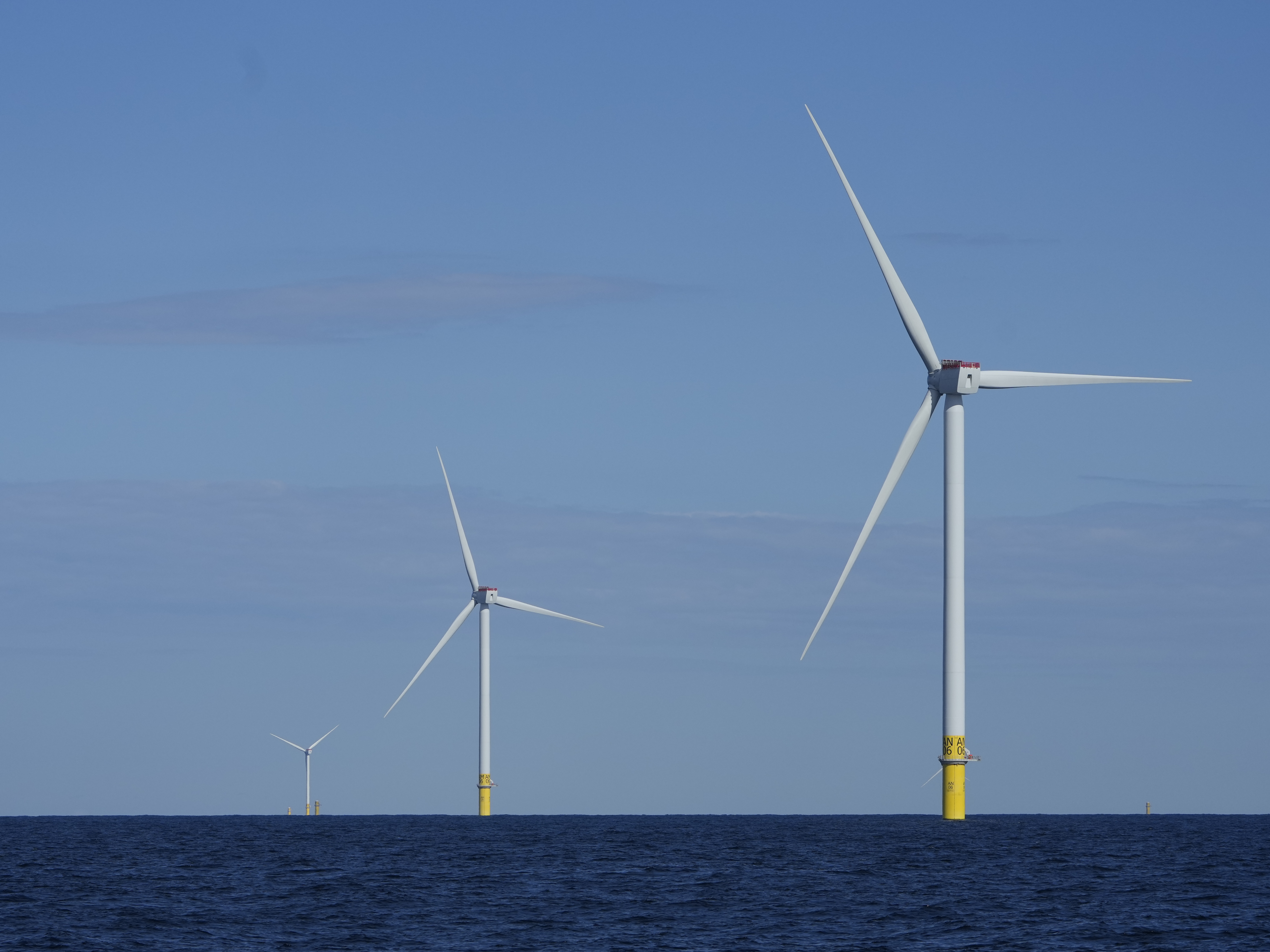 caption: Wind turbines of South Fork Wind are seen off the coast of Block Island, R.I., on Oct. 9, 2024.