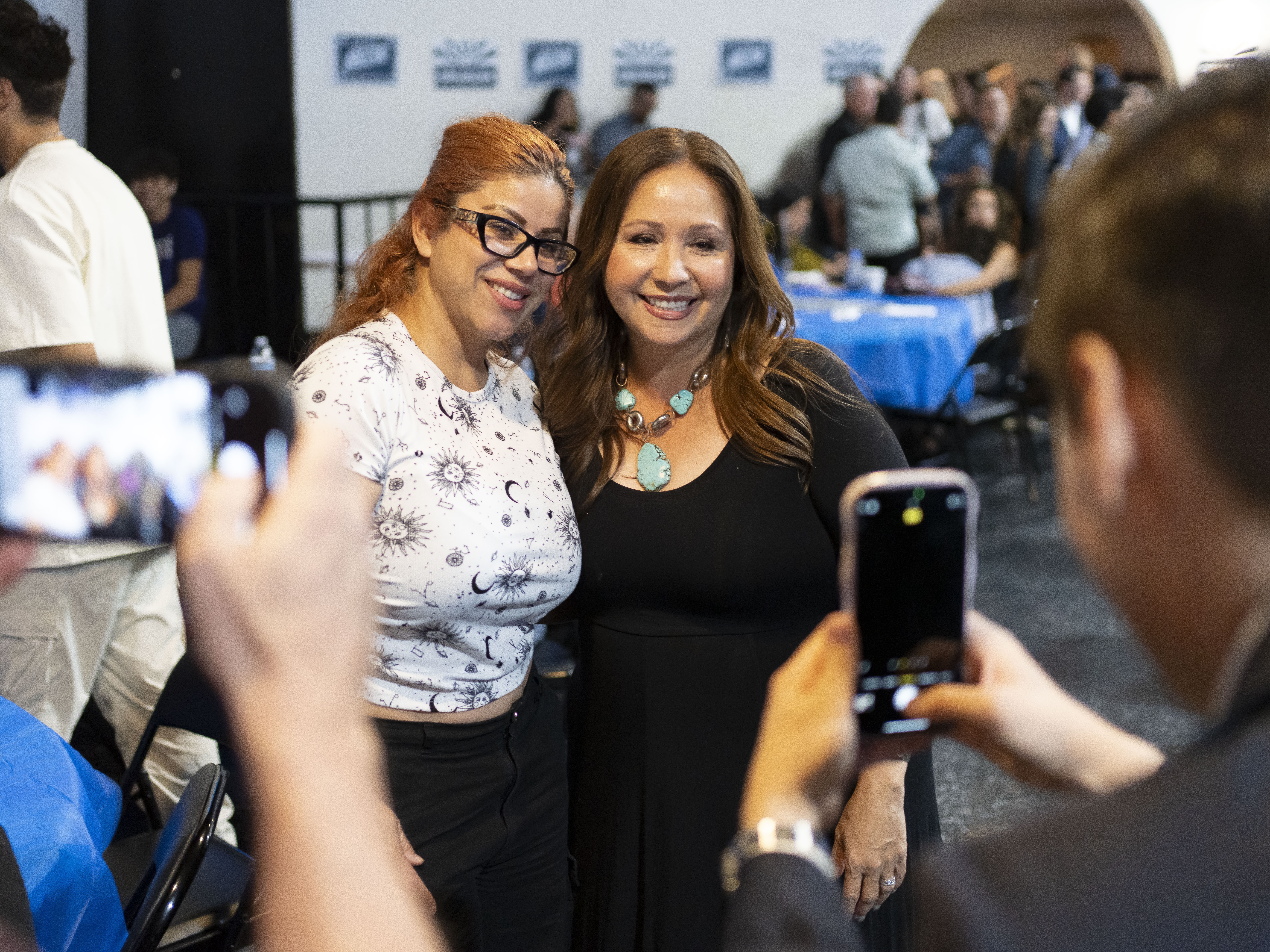 caption: Democratic U.S. congressional candidate Adelita Grijalva poses with supporters at a primary election-night party at El Casino Ballroom on July 15 in South Tucson, Ariz. Grijalva said social media is important but is just one tool in a tool kit that needs to include grassroots organizing, coalition building and talking with people.