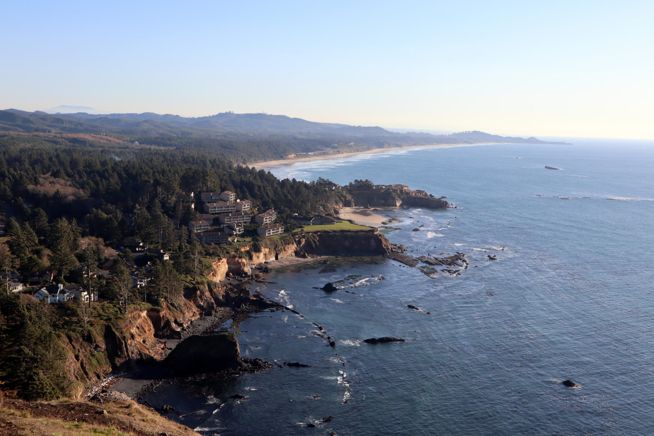caption: Otter Rock, offshore at upper right, is where one of the last wild Oregon sea otters was killed by a hunter more than a century ago. CREDIT: TOM BANSE