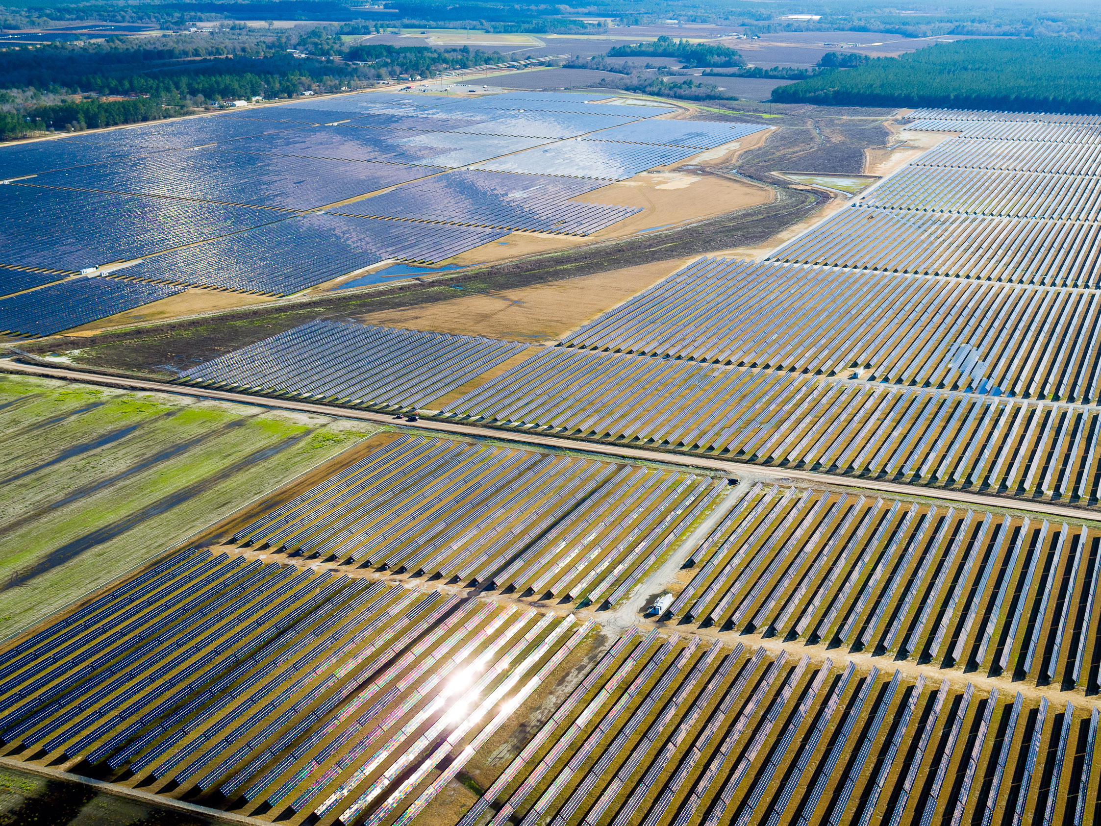 caption: An aerial view of the 52-megawatt solar farm built by Silicon Ranch in Hazlehurst, Ga. Ever cheaper and better solar technology, available land and lots of sunshine are driving demand for massive, utility-scale solar projects across the American Southeast.