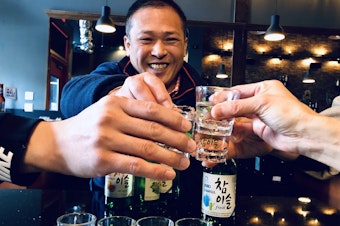 caption: Dan Cho of Coho Imports supports a bill that would allow Korean restaurants to serve soju by the bottle at the table. State law requires distilled spirits to be served by the shot glass only.  