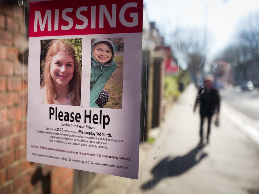 caption: Posters seeking information about Sarah Everard appear near Clapham Common in London in March after her disappearance. Her body was later found in Kent in southeast England. Wayne Couzens, a London Metropolitan Police officer, has admitted to kidnapping and raping Everard.