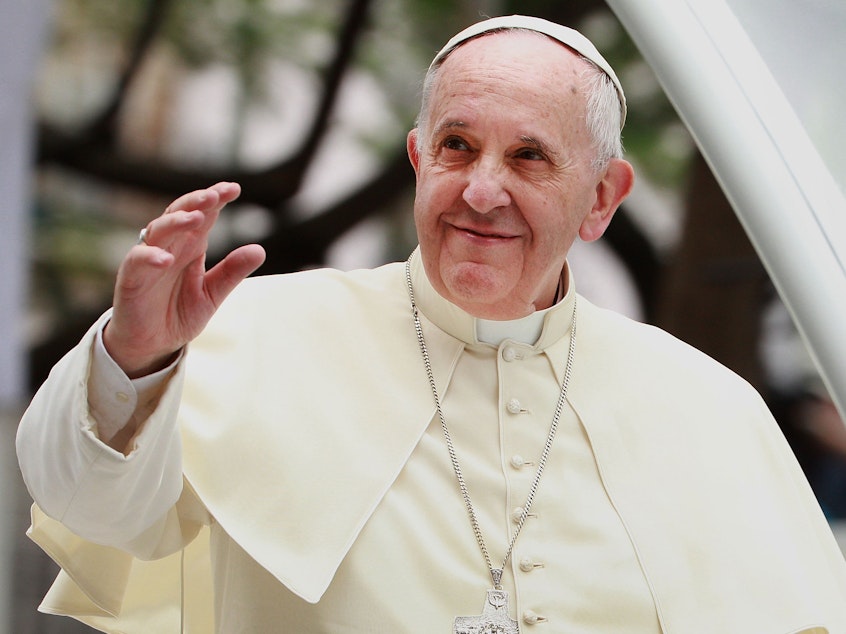 caption: Pope Francis is a staunch advocate for addressing climate change.