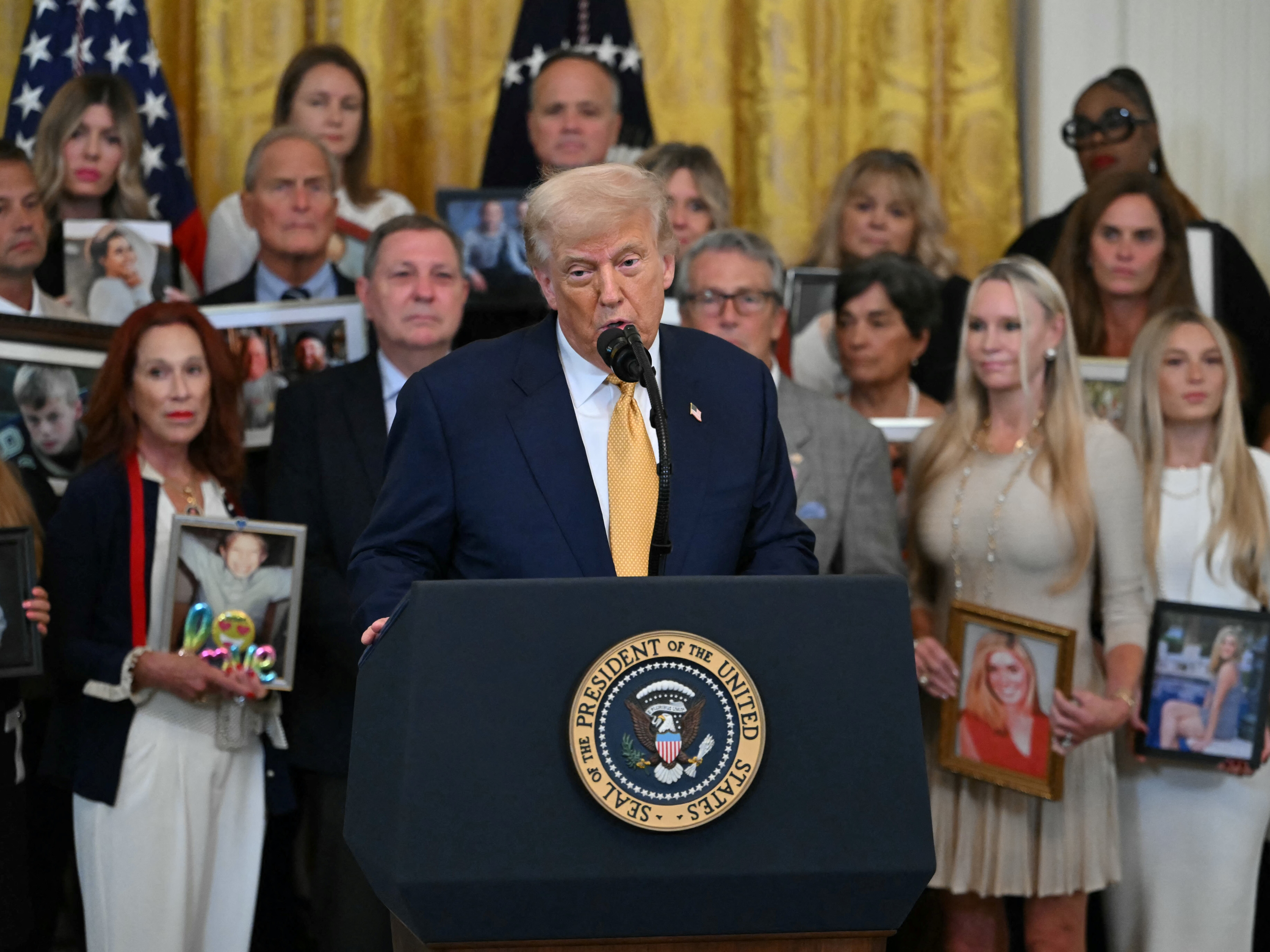 caption: President Trump speaks before signing the "Halt All Lethal Trafficking of Fentanyl Act," which strengthens prison sentences for fentanyl traffickers, in the East Room of the White House in Washington, D.C., on July 16.