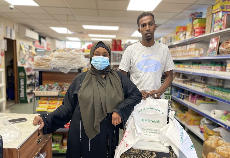caption: Fardowsa Salad (L) and her coworker at Sharif Grocery and Halal in Rainier Beach