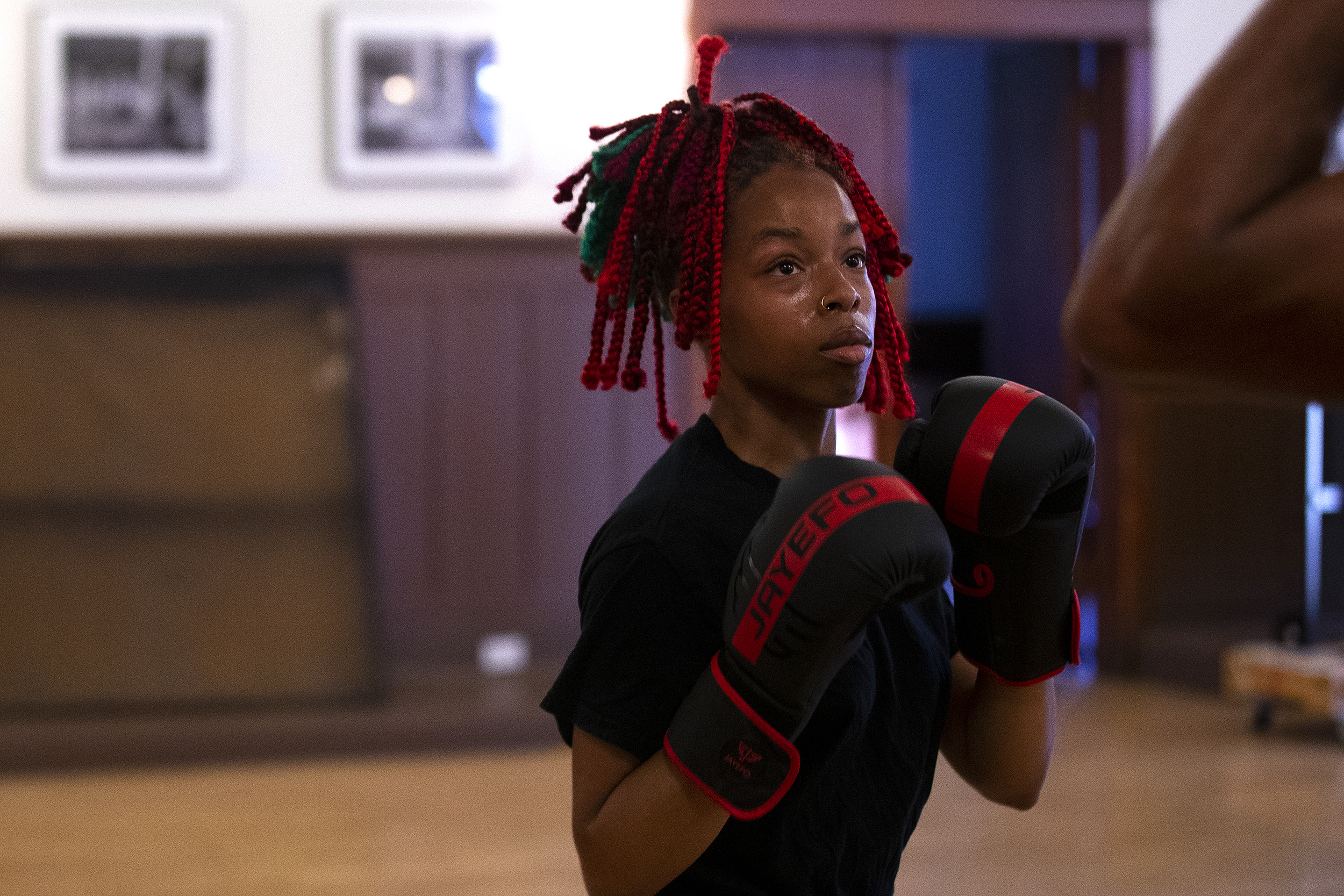 caption: Sky Muse, 21, boxes on Wednesday, July 17, 2024, at Washington Hall in Seattle. 