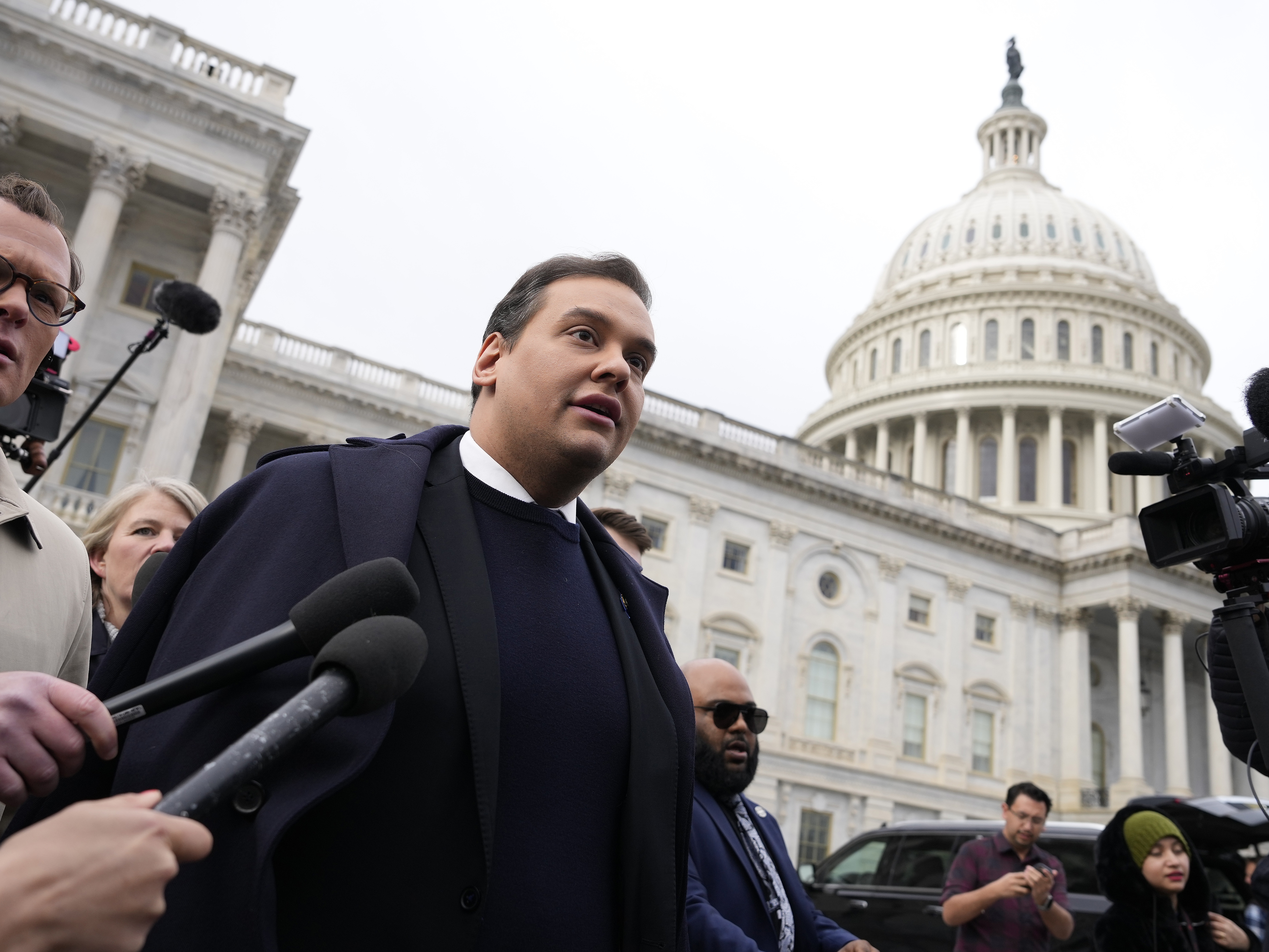 caption: George Santos leaves the U.S. Capitol after his fellow members of Congress voted to expel him from the House of Representatives on December 01, 2023. The New York Republican was later sentenced to prison after pleading guilty to range of federal charges, but President Trump has now commuted his sentence.