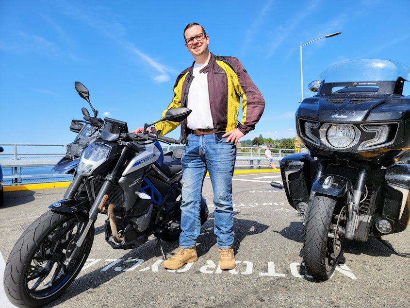 caption: William Almond waits for the ferry at the Edmonds terminal as part of his daily commute.