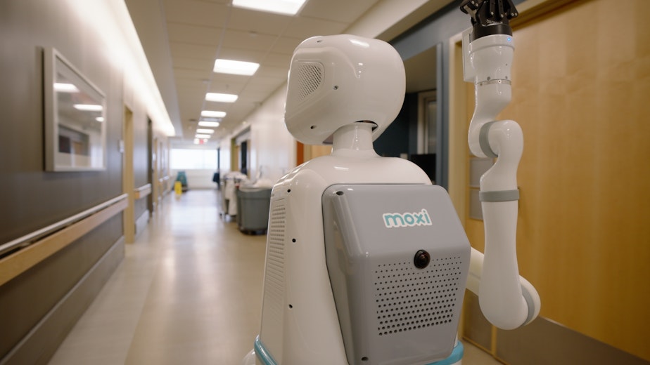 caption: Moxi hospital robot in action.