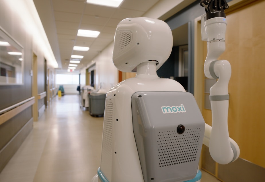 caption: Moxi hospital robot in action.