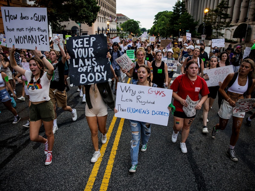 caption: Abortion rights activists protest in Washington, DC, on June 26, 2022, two days after the US Supreme Court scrapped half-century constitutional protections for the procedure.