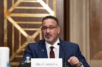 caption: President Biden's education secretary nominee, Miguel Cardona, appeared before the Senate Health, Education, Labor and Pensions Committee on Wednesday.