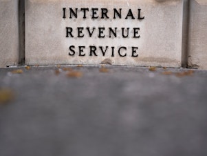 caption: The Internal Revenue Service building is seen in Washington, D.C., on April 5. The IRS got $80 billion in new funding as part of the climate and health care bill passed by Congress on Friday. Most of that money will be used to target wealthier tax evaders.