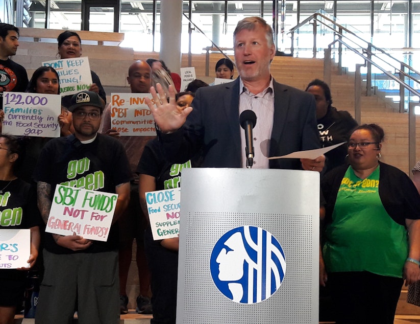 caption: Seattle Councilmember Mike O'Brien said his bill ensures that soda tax revenue will be used for programs helping low income families disproportionately affected by the surcharge. 