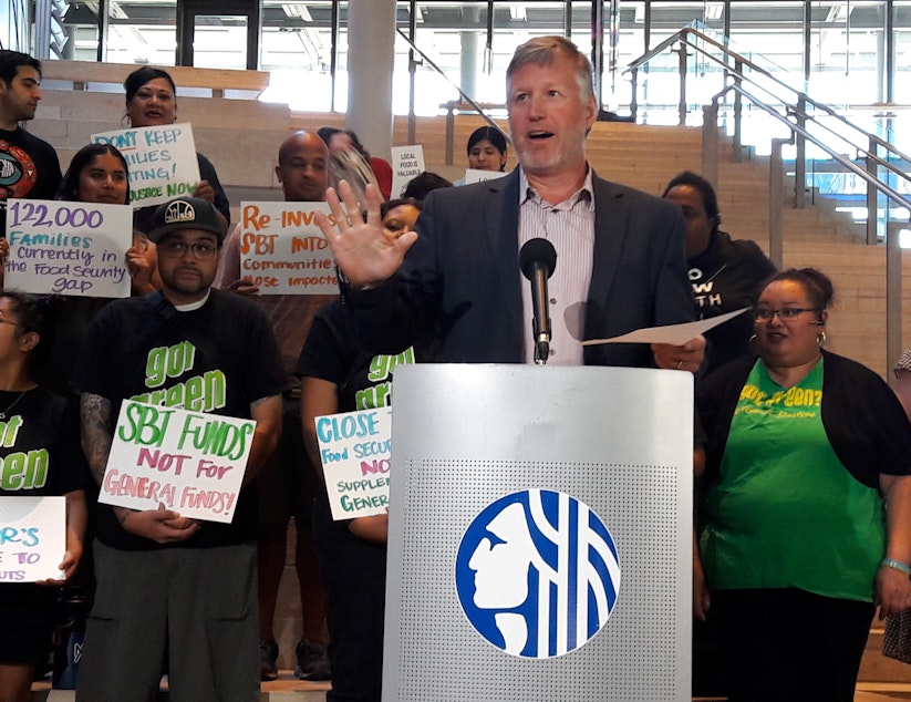 caption: Seattle Councilmember Mike O'Brien said his bill ensures that soda tax revenue will be used for programs helping low income families disproportionately affected by the surcharge.