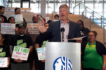 caption: Seattle Councilmember Mike O'Brien said his bill ensures that soda tax revenue will be used for programs helping low income families disproportionately affected by the surcharge. 
