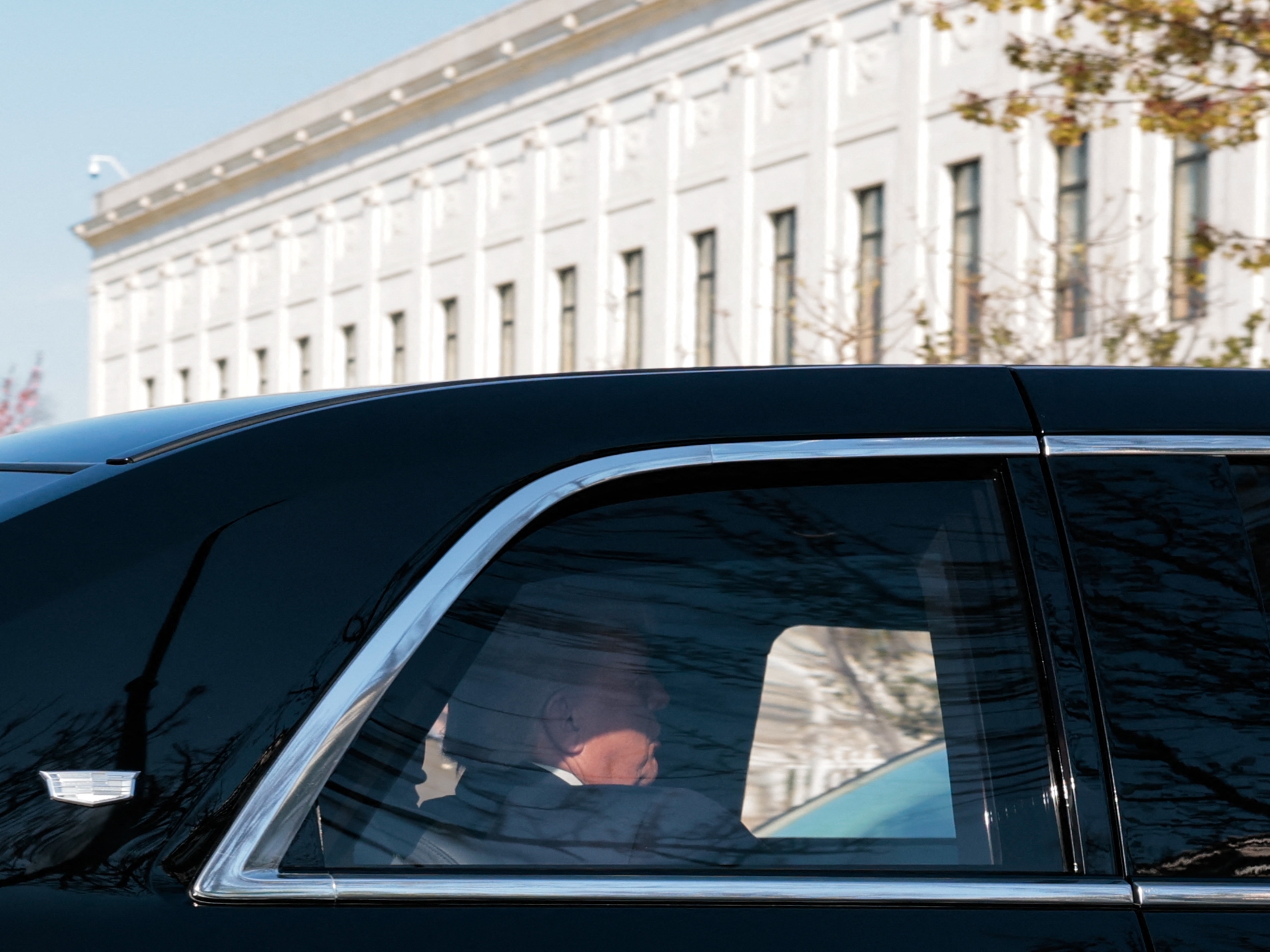 caption: President Trump's car arrives at the U.S. Supreme Court on Wednesday morning.