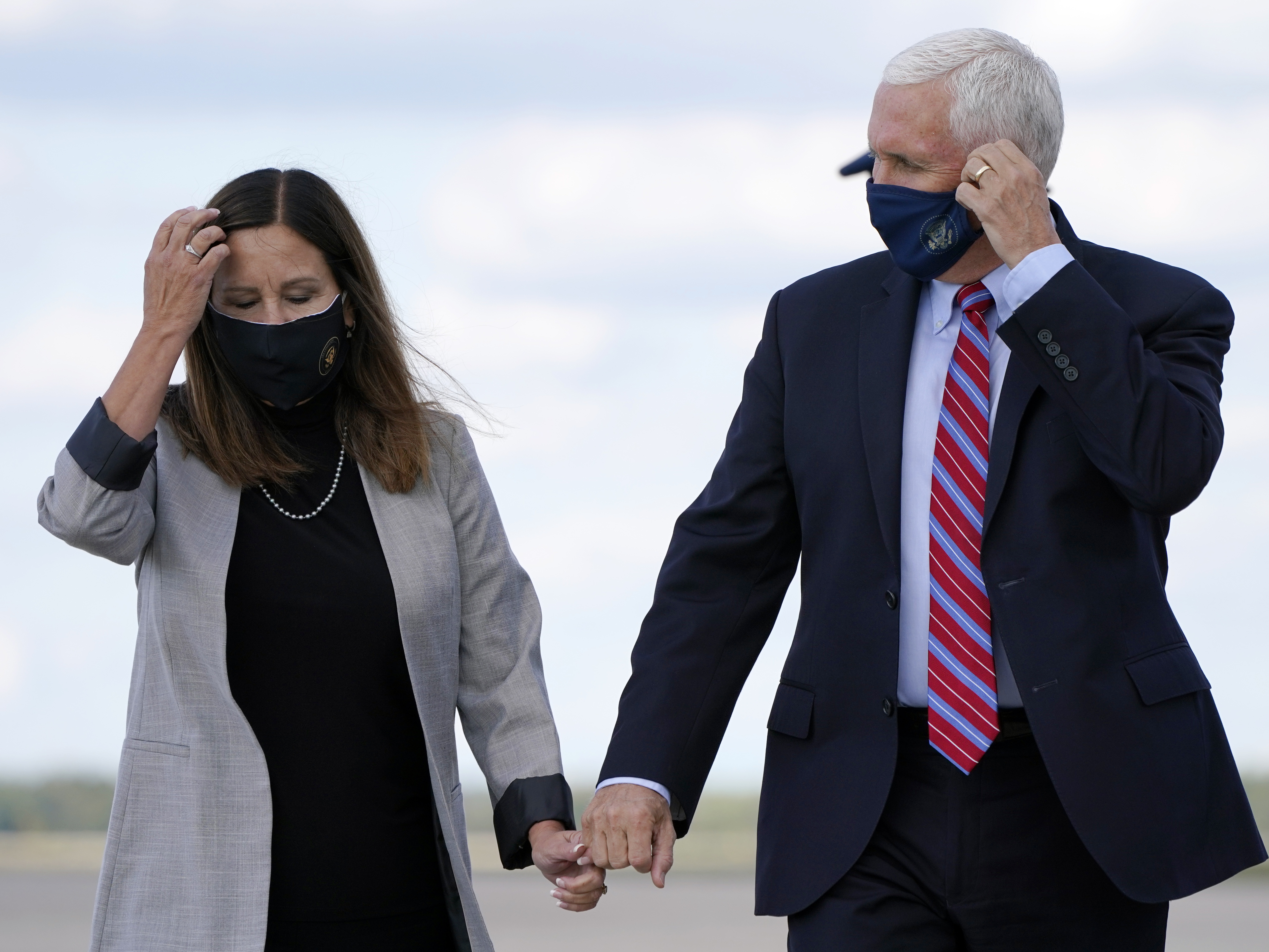 caption: Vice President Mike Pence and his wife, Karen Pence, are wearing masks in an attempt to protect themselves against the coronavirus.