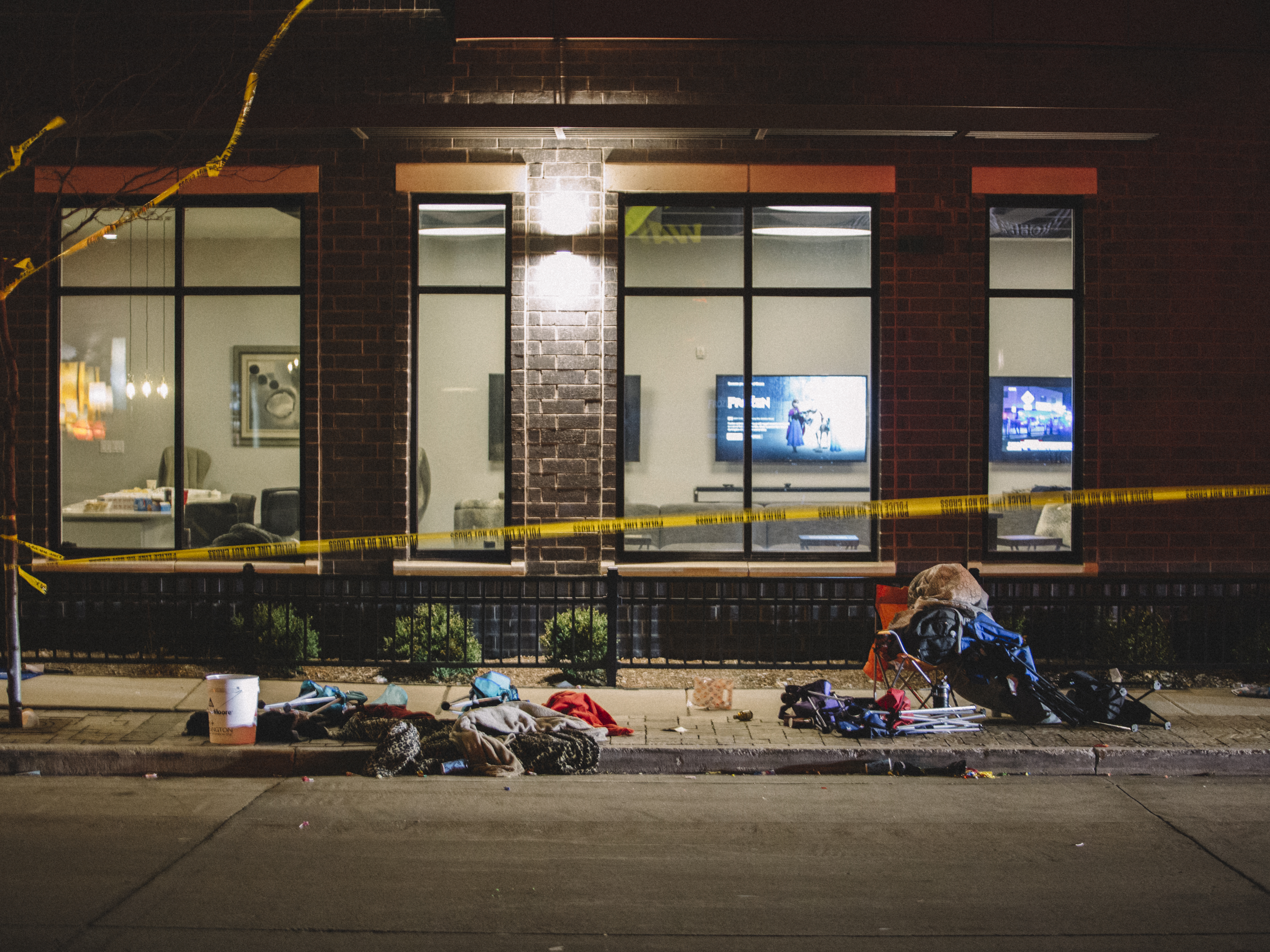 caption: Debris litters the street at a crime scene on Sunday in Waukesha, Wis., after a person in an SUV slammed into pedestrians at a holiday parade.