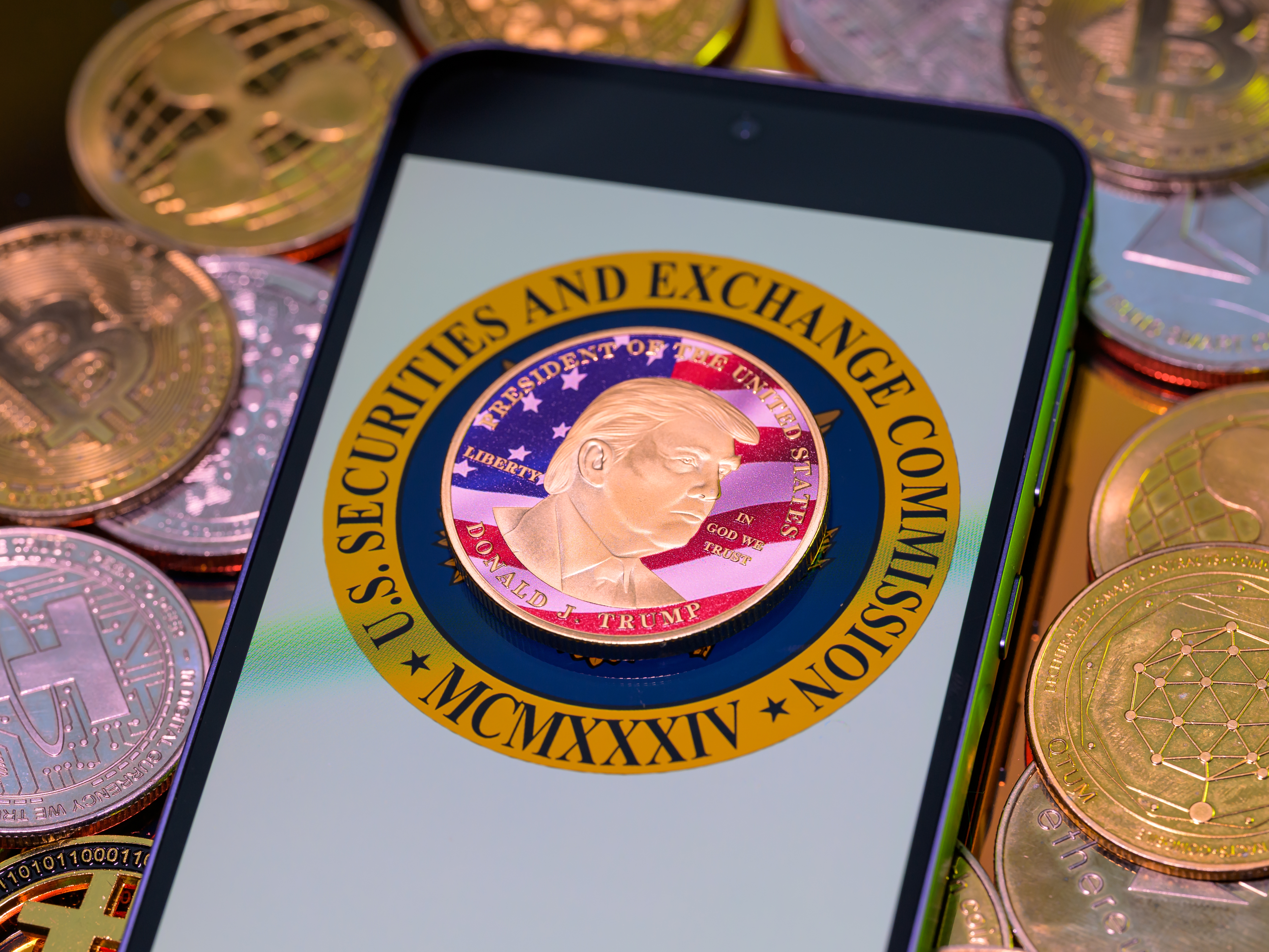 caption: A photo illustration shows a representation of cryptocurrency coins with the $Trump meme coin (collection coin) in Brussels, Belgium, on Monday.