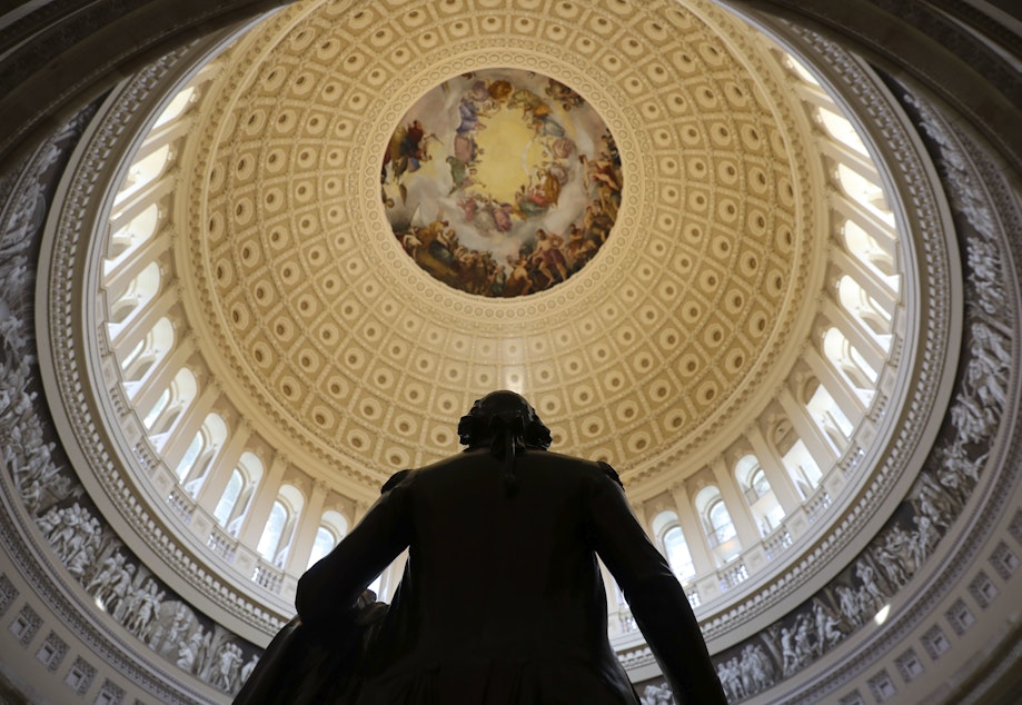 caption: The Capitol Rotunda is seen with the statue of George Washington on Capitol Hill in Washington, Tuesday, Jan. 30, 2018, ahead of the State of the Union address by President Donald Trump.