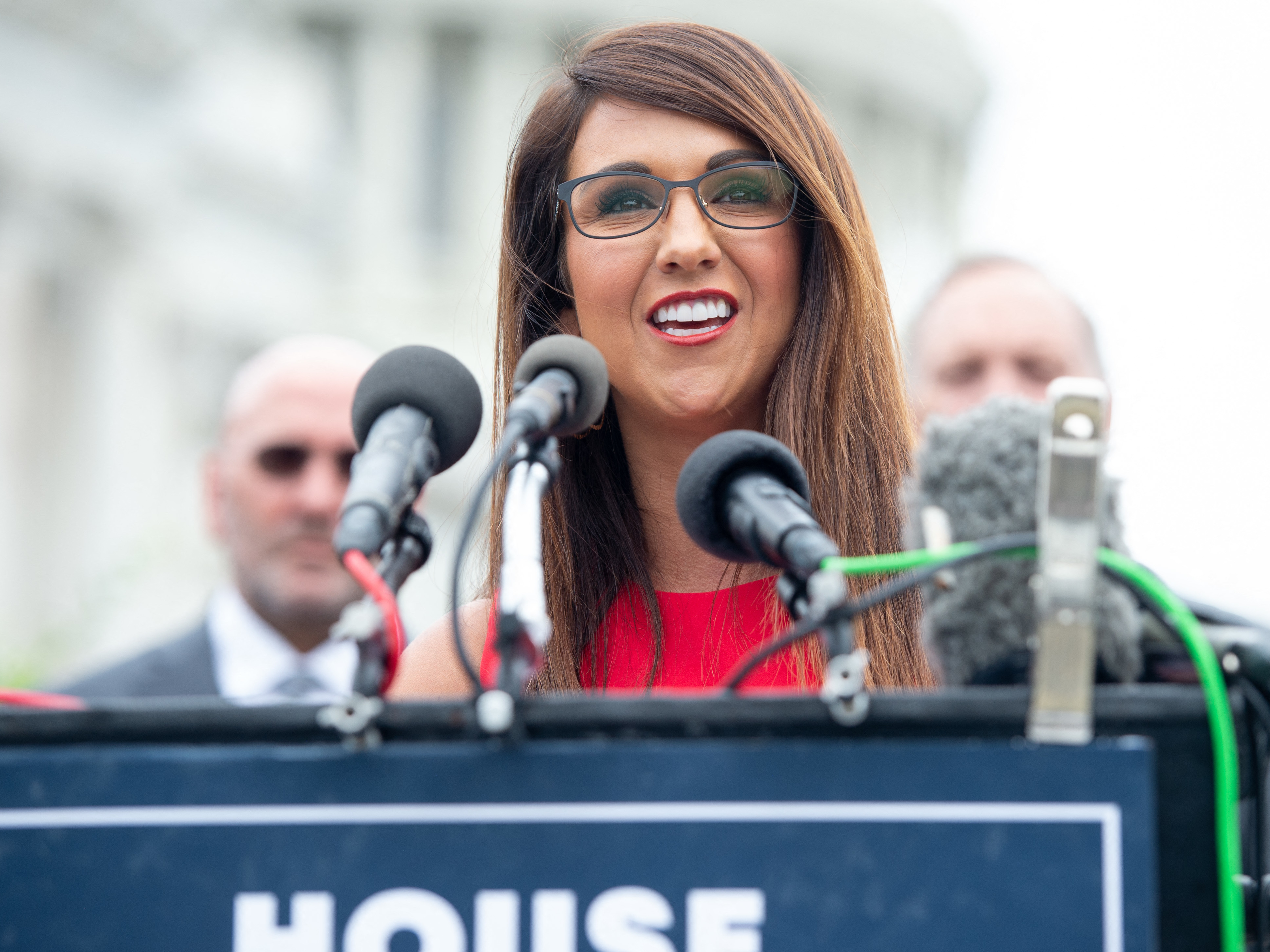 caption: Rep. Lauren Boebert, R-Colo., speaks during a news conference outside the Capitol in August.