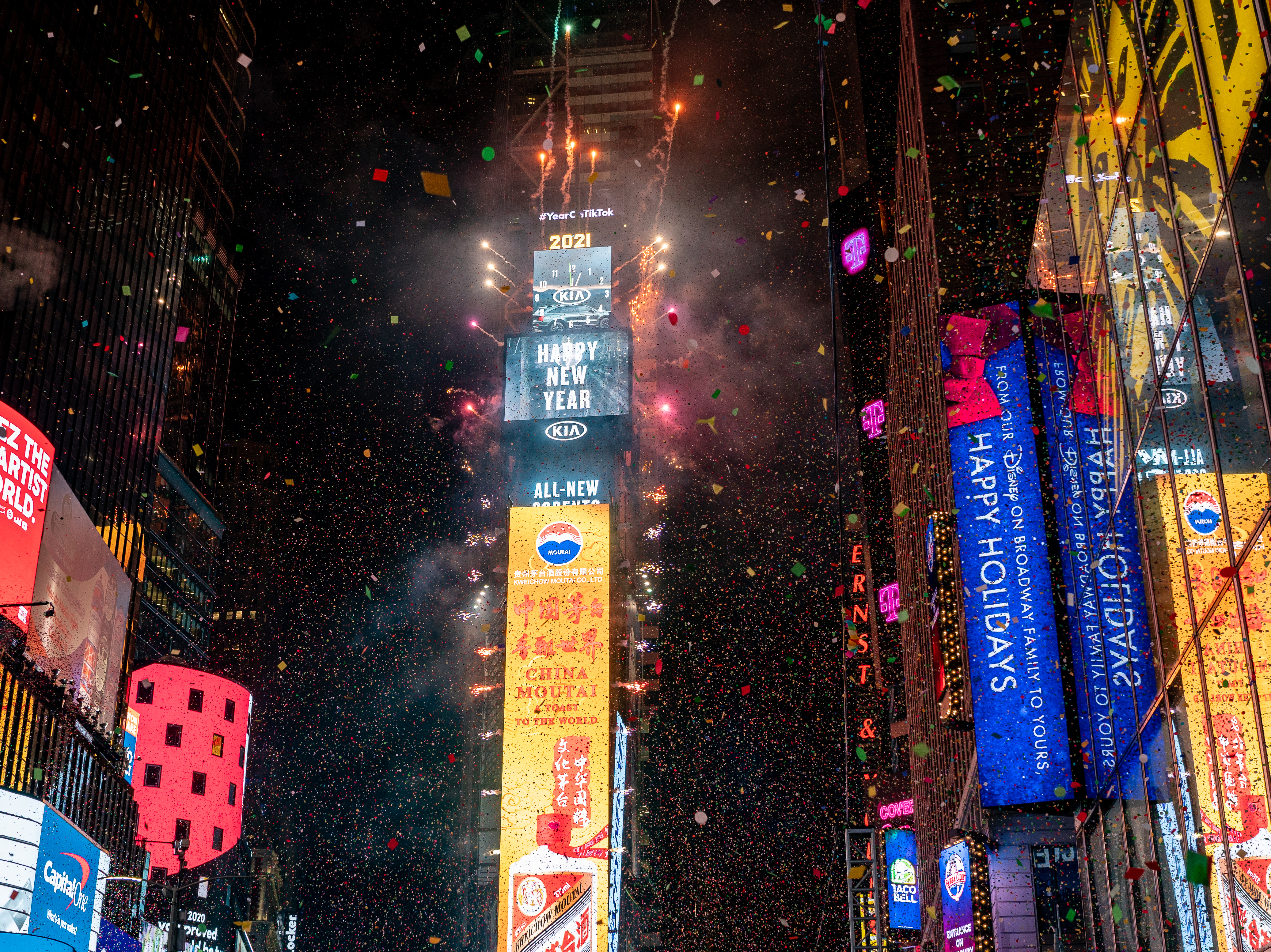 caption: The New Year's Eve ball drops in a mostly empty Times Square on Jan. 1, 2021, in New York City.