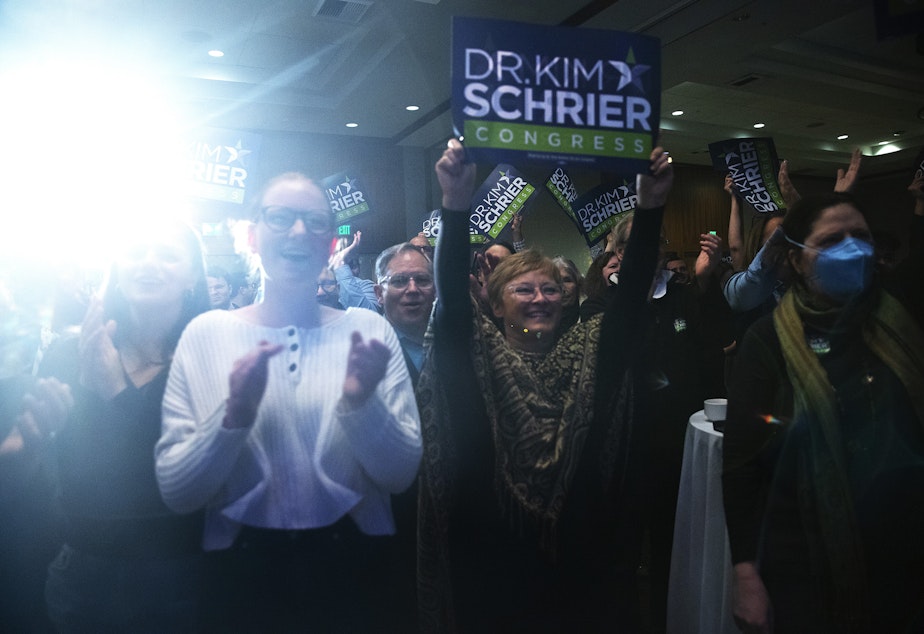 caption: Supporters of congresswoman Kim Schrier cheer as she takes the stage during an election night party on Tuesday, November 8, 2022, at the Westin in Bellevue. 