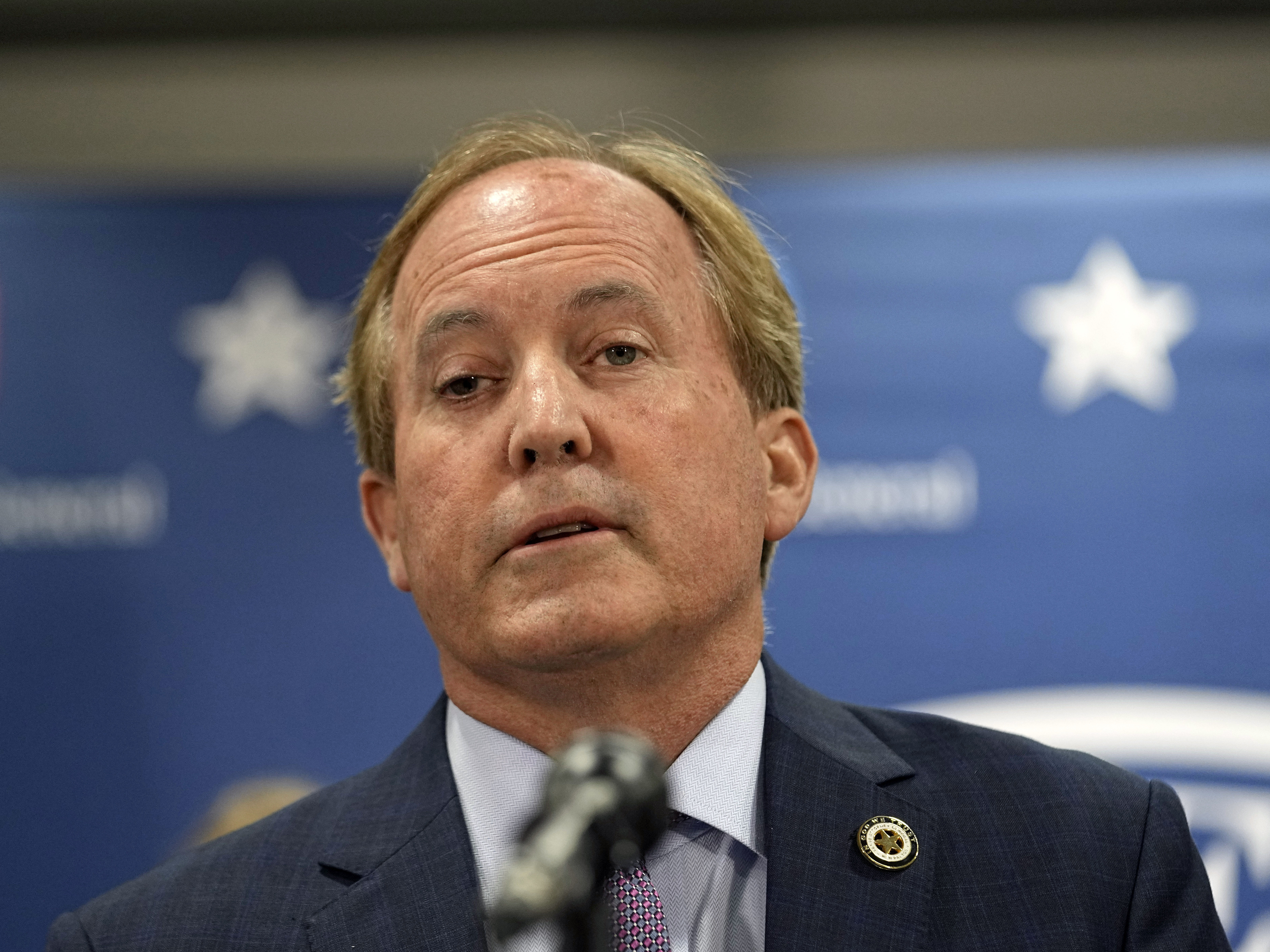 caption: Texas state Attorney General Ken Paxton reads a statement at his office in Austin, Texas, Friday, May 26, 2023. An investigating committee says the Texas House of Representatives will vote Saturday on whether to impeach.