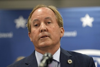 caption: Texas state Attorney General Ken Paxton reads a statement at his office in Austin, Texas, Friday, May 26, 2023. An investigating committee says the Texas House of Representatives will vote Saturday on whether to impeach.