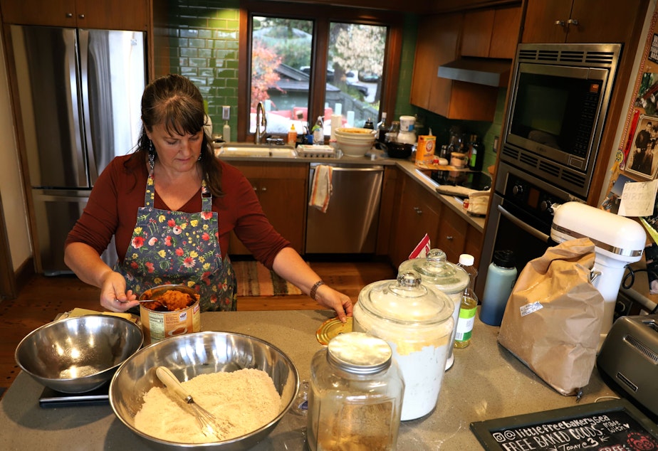caption: Lanne Stauffer combines ingredients to make treats for her little free bakery in Magnolia. 