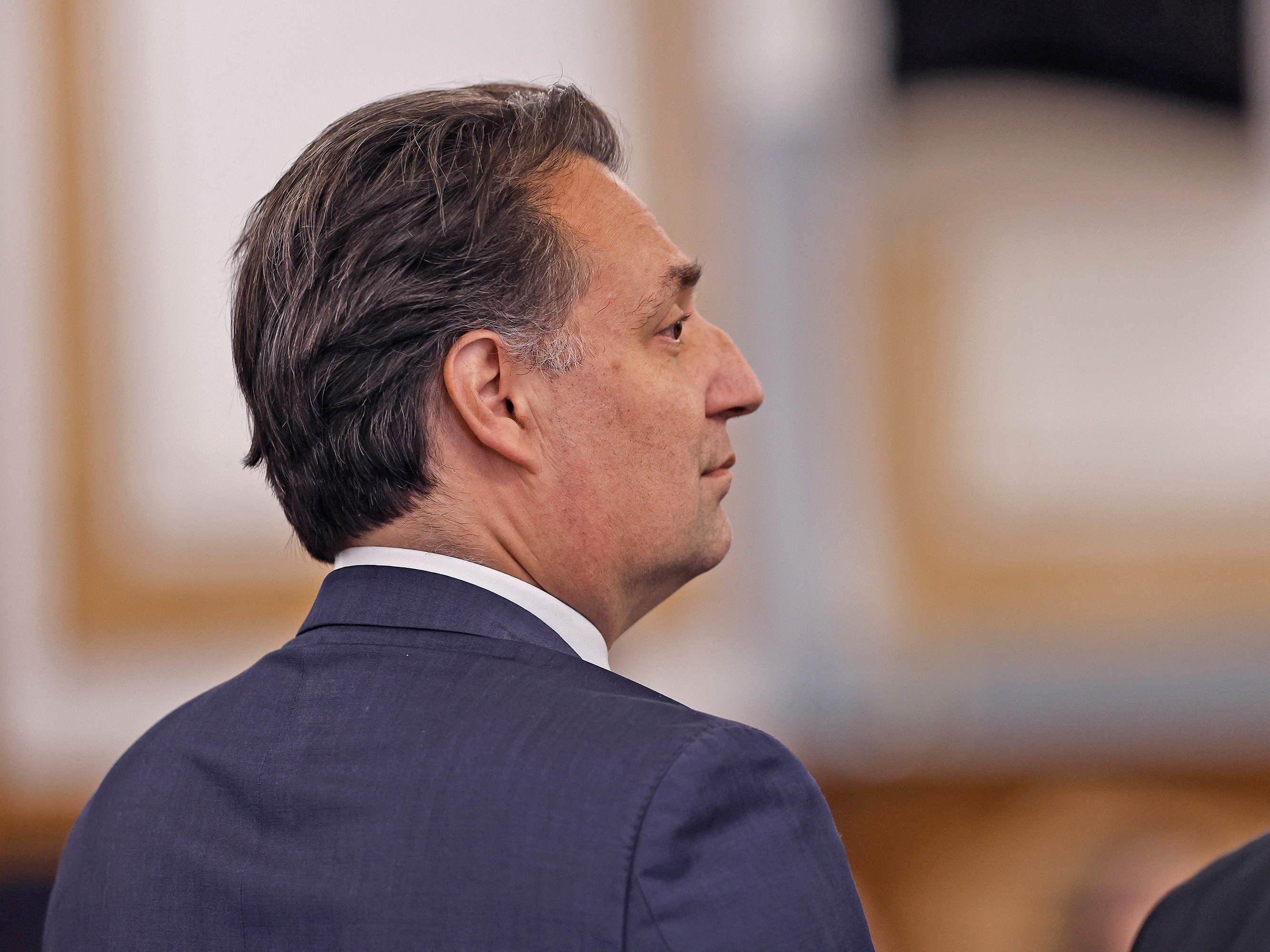 caption: Brian Walshe stands in Norfolk Superior Court in Dedham, Mass., on Monday, after a jury found him guilty of first-degree murder of his wife Ana in 2023.