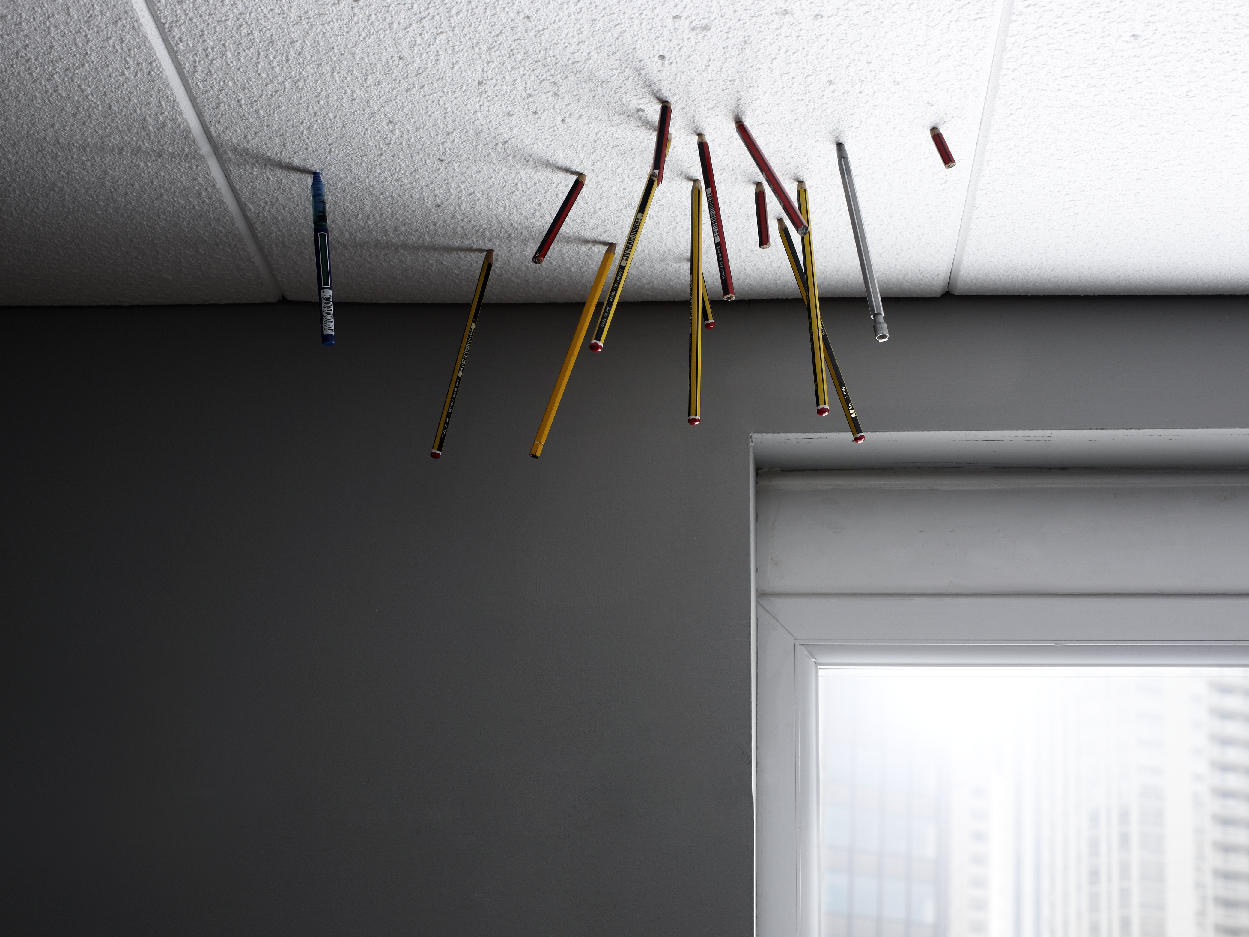 caption: A musician, disoriented by his loss of work and the inefficiency of bureaucracy, made the best of waiting in line for unemployment by making music.