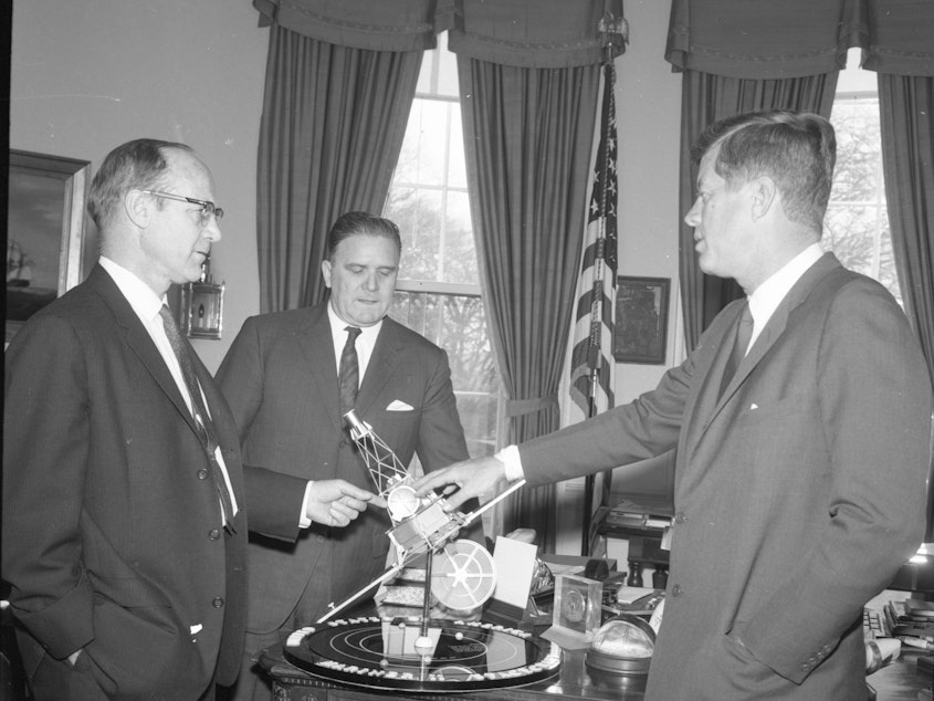 caption: NASA's new telescope bears the name of James Webb (center), an influential figure who was appointed by President John F. Kennedy to lead the space agency during the '60s. But some astronomers say discrimination against gay and lesbian government employees during his tenure should preclude him from having a telescope named in his honor.
