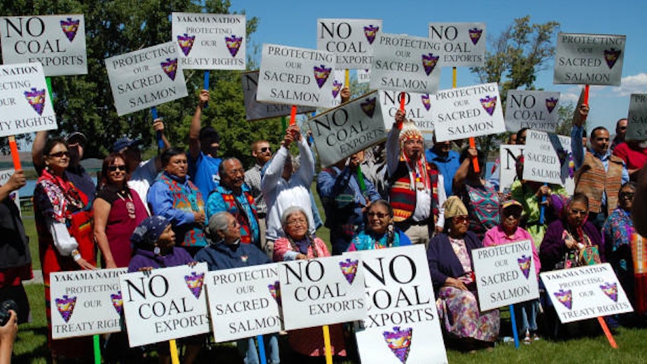 caption: Yakama Nation and Lummi Nation tribal members protest in May 2014 against the proposed coal export facility in Boardman, Ore. A Pacific Rim trade agreement raises questions about whether investors could challenge state decisions to stop such facilities.