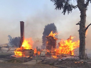 caption: In this photo from the Whitman County Sheriff's Office, little remains of a building in Malden, Wash. Wildfire gutted the town of about 200 people south of Spokane on Labor Day.