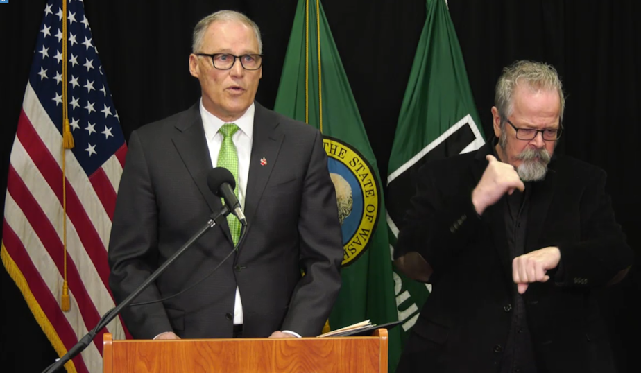caption: Gov. Jay Inslee announces a ban on large events and gatherings of more than 250 people in King, Snohomish, and Pierce counties on Wednesday, March 11, 2020.
