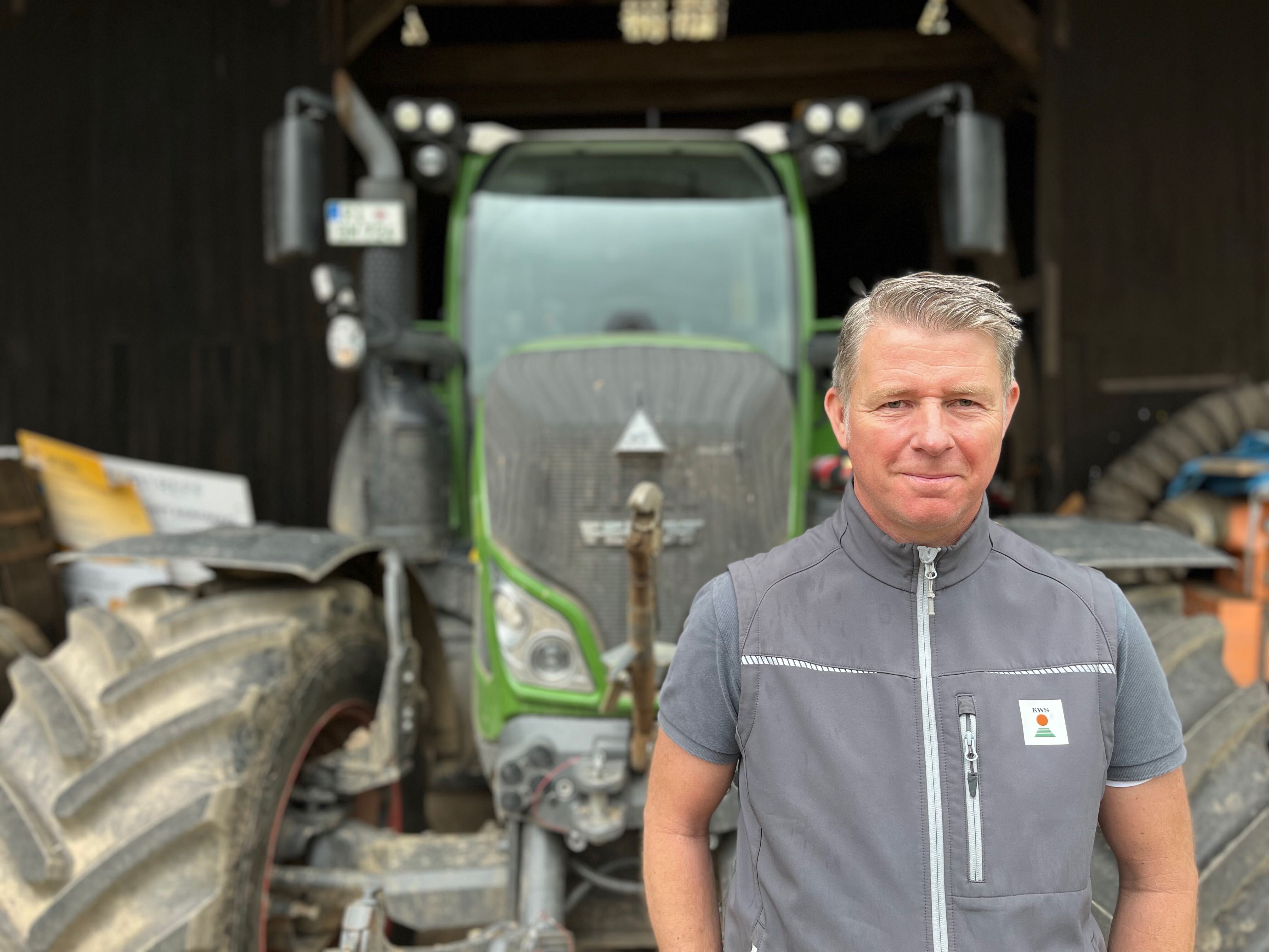 caption: Anthony Lee stands in front of his barn on his family farm in the German state of Lower Saxony. Lee has been an outspoken critic of the European Union’s climate change policies and has been a leader in the farmer protest movement in Europe. He’s running for EU Parliament for the right-wing Free Voter party and his YouTube channel has over 24 million views.