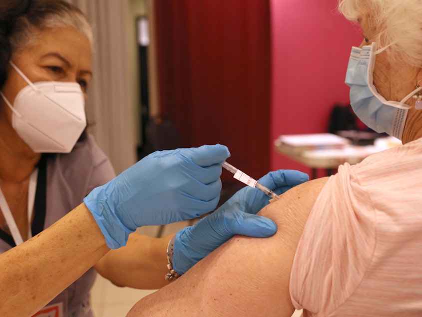 caption: Another round of COVID-19 vaccines is on the way. The Food and Drug Administration approved vaccines from Pfizer and Moderna that target an omicron subvariant called XBB.1.5. Vaccination campaigns, like this one in San Rafael, Calif., in 2022, could resume soon.