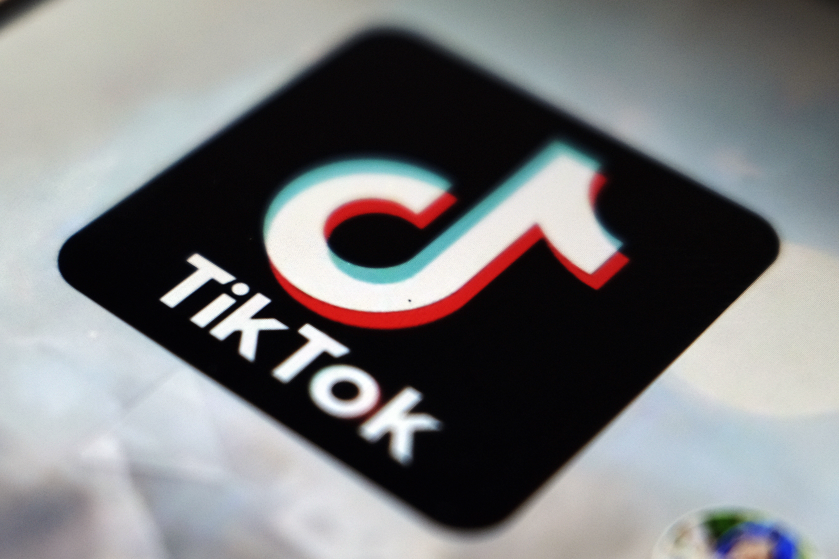 caption: The TikTok app logo. (Kiichiro Sato/AP)