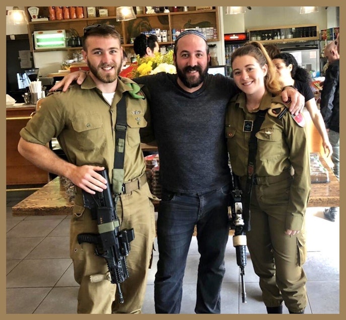 caption: Dan Swedlow with his son Shneur, left, and daughter Kayla, on the right, in 2019 when both were on active duty with the Israel Defense Forces.