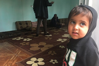 caption: Ibrahim, 2, in northeastern Syria a few hours after his freed Yazidi mother returned to Iraq without him. Ibrahim's father was an ISIS fighter. Although his mother wanted to take him home, the Yazidis do not allow children of ISIS fathers to live with the community. Iraqi law considers the children Muslim rather than Yazidi.