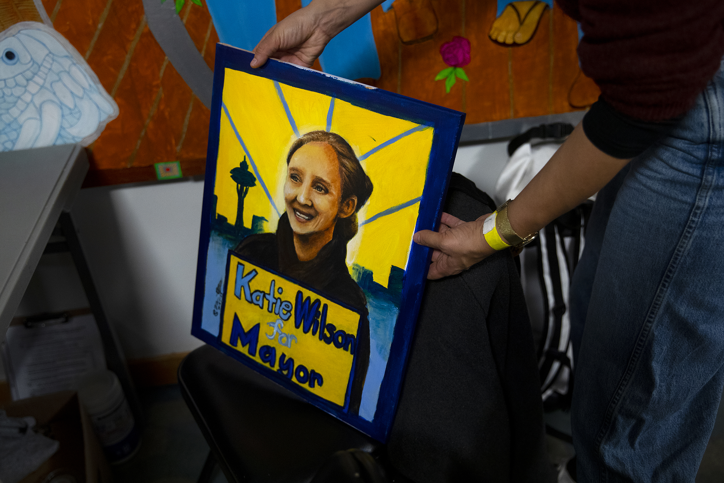 caption: A painting of city of Seattle mayoral candidate Katie Wilson is displayed as supporters arrive for an election night party on Tuesday, November 4, 2025, at El Centro de la Raza in Seattle. 