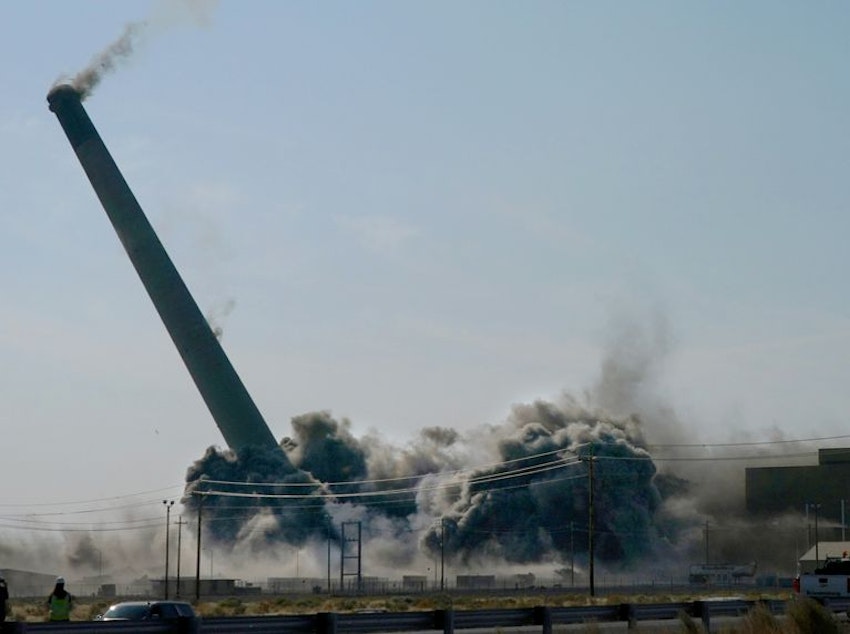 caption:  The towering smokestack at Portland General Electric’s shuttered coal-fired power plant near Boardman has fallen, heralding the end of the era of coal-fired power generation in Oregon, Sept. 15, 2022.