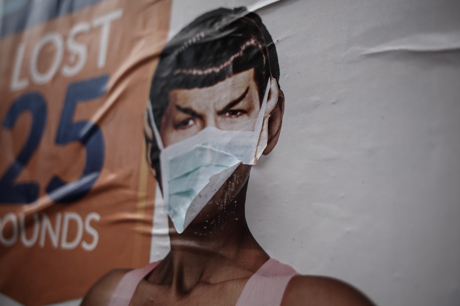 caption: Mr. Spock wears a face mask in this wall art seen in Seattle in 2020. The work was done by local artist Sub Space, who spreads works of Spock around Seattle. When the Covid-19 pandemic struck, they returned to their Spocks around Seattle and added face masks. 