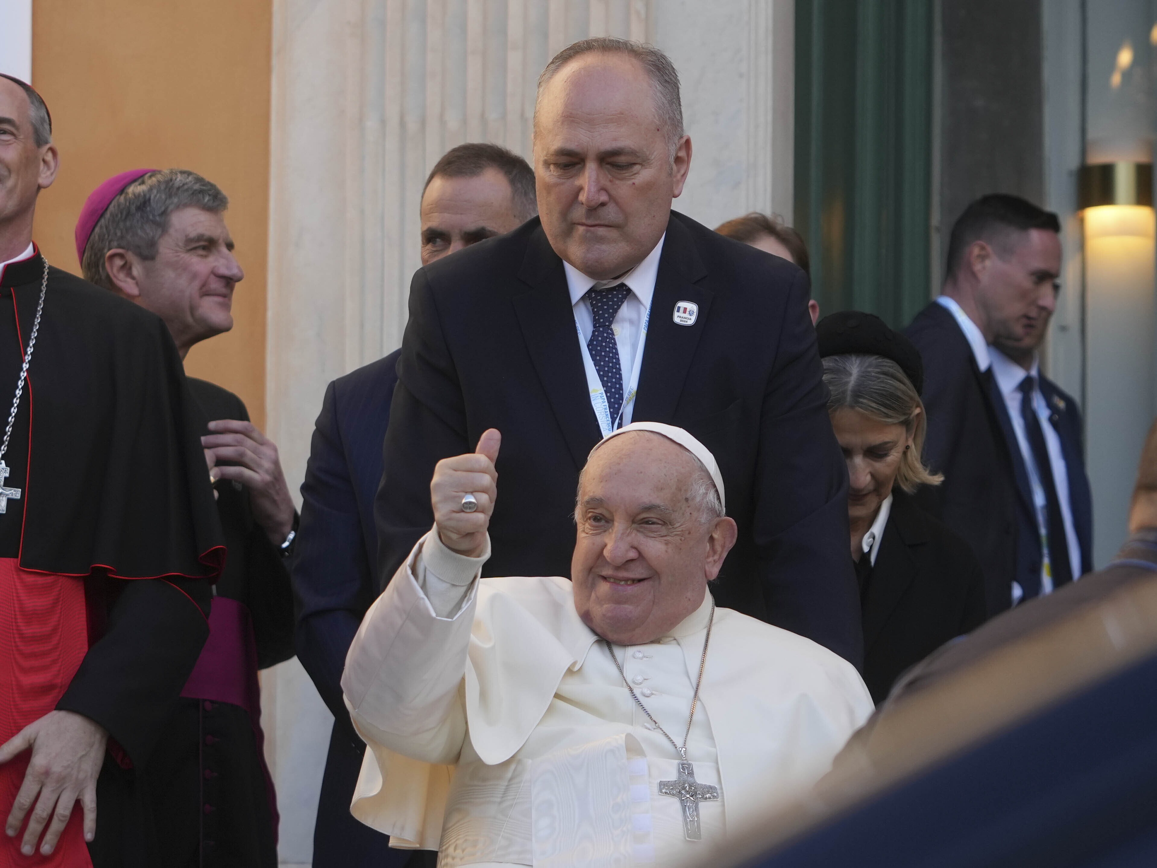 caption: Pope Francis greets faithful during a visit to the French island of Corsica on Dec. 15. President Biden has awarded Pope Francis the Presidential Medal of Freedom with distinction.