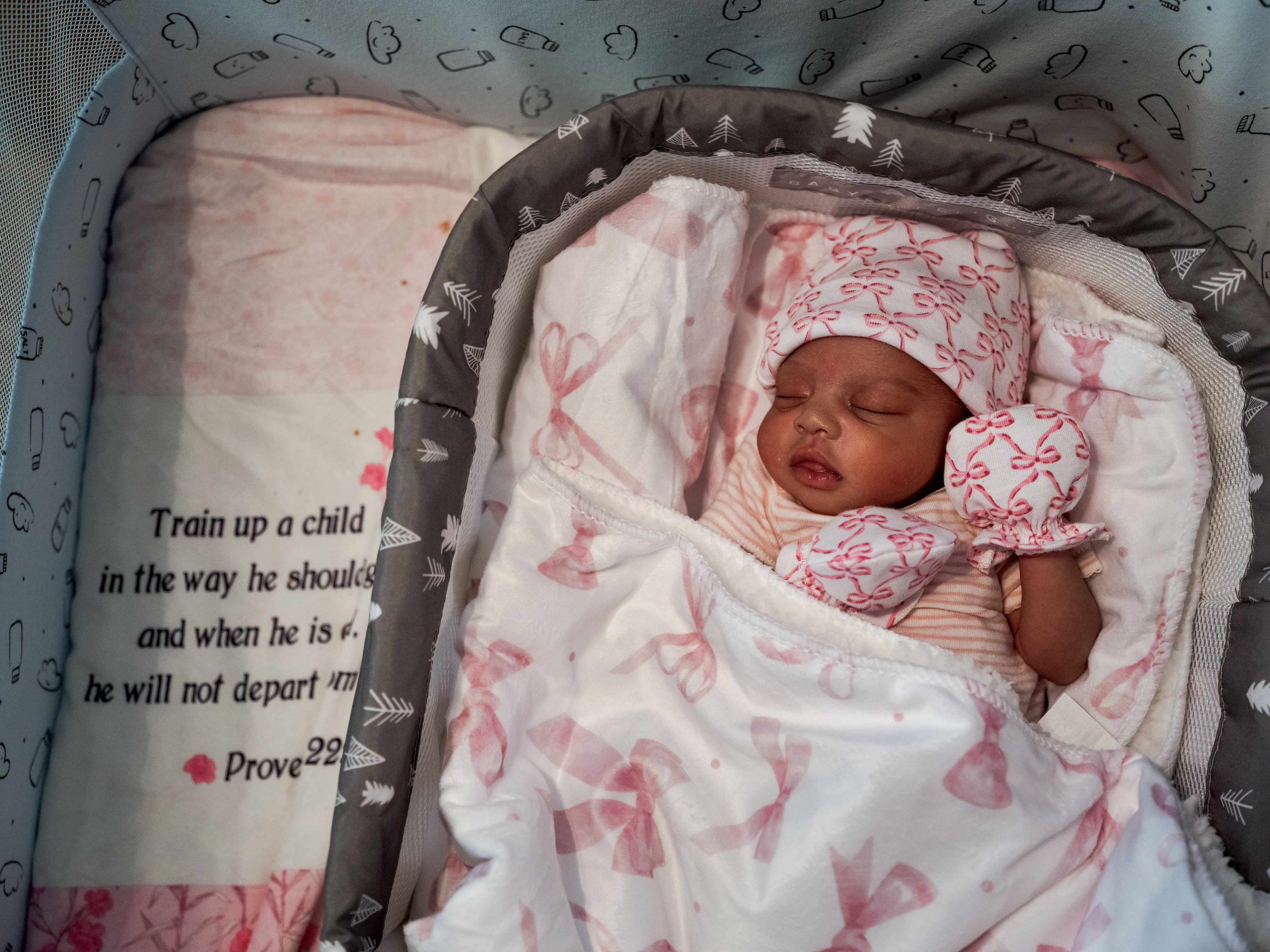 caption: Kaomi Holmes, 10 days old, sleeps in her crib at her home in Greenville, Miss. She was delivered by emergency cesarian section and weighed 4.5 pounds at birth.