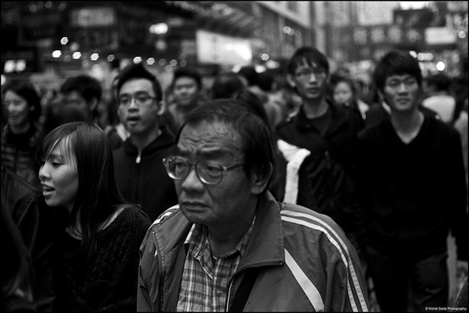 caption: A crowded street in Hong Kong.