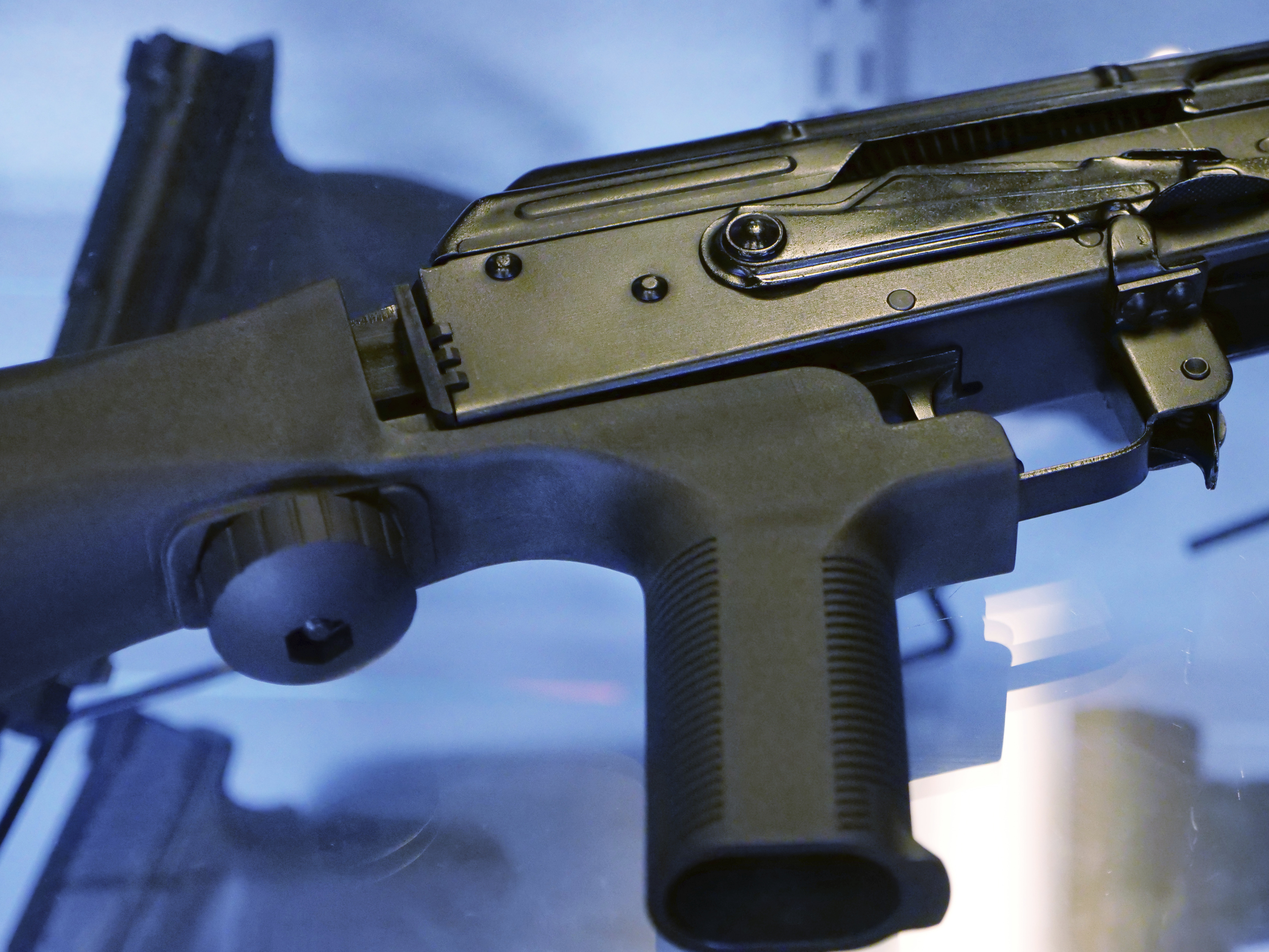 caption: The Trump administration is moving to ban bump stocks, like the one attached to the rifle above, which allow semiautomatic weapons to fire rapidly.